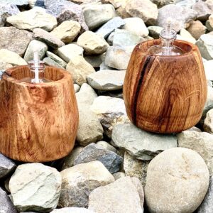 wooden tea lights on stones