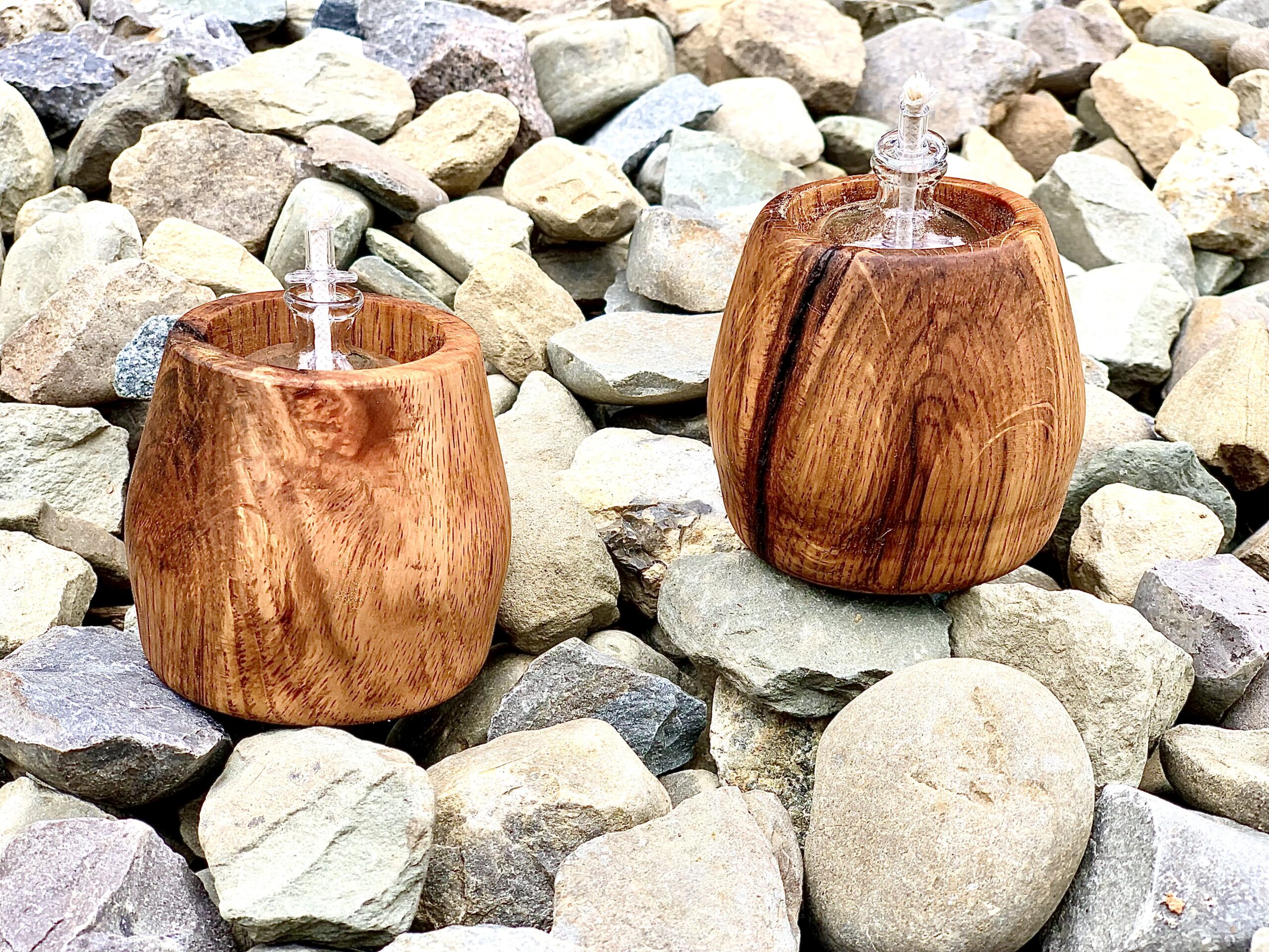 wooden tea lights on stones